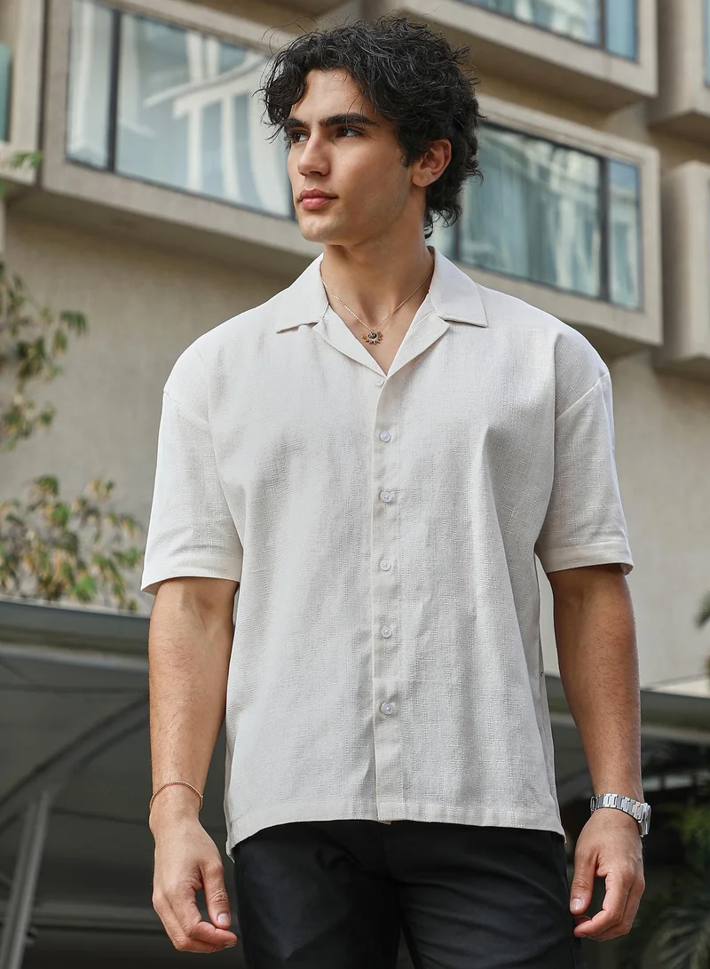 كامبوس سوترا Men's Ivory White Solid Resort Overised Shirt For Casual Wear | Cuban Collar | Short Regular Sleeves | Button Closure | Oversized Shirt Crafted With Comfort Fit For Everyday Wear